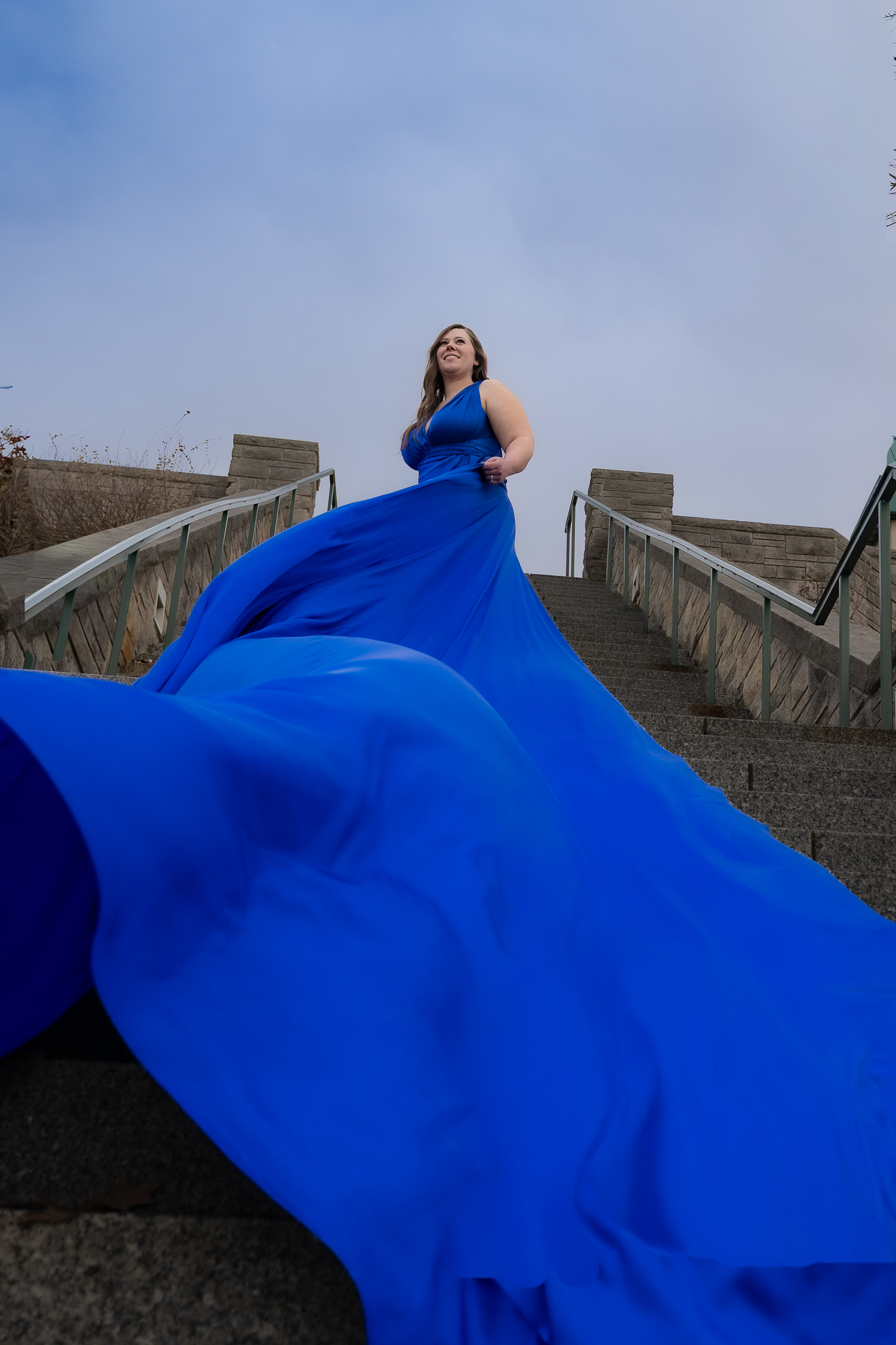 blue flying dress down stairs